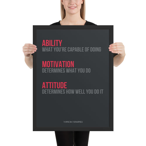 Person holding a framed motivational poster with text on a white background