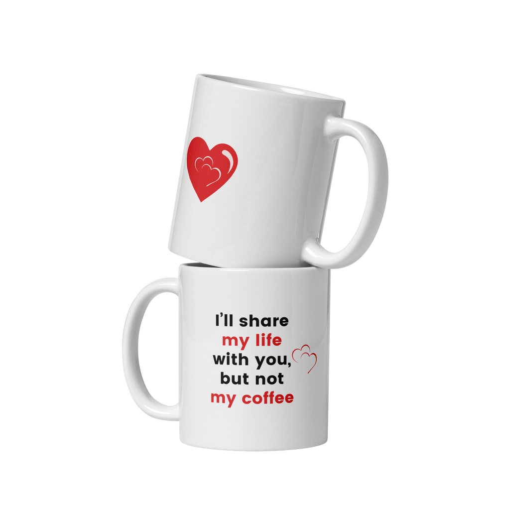 Two white ceramic mugs stacked together. The top mug has a red heart and the text 'I'll share my life with you', and the bottom mug has the text 'but not my coffee'.