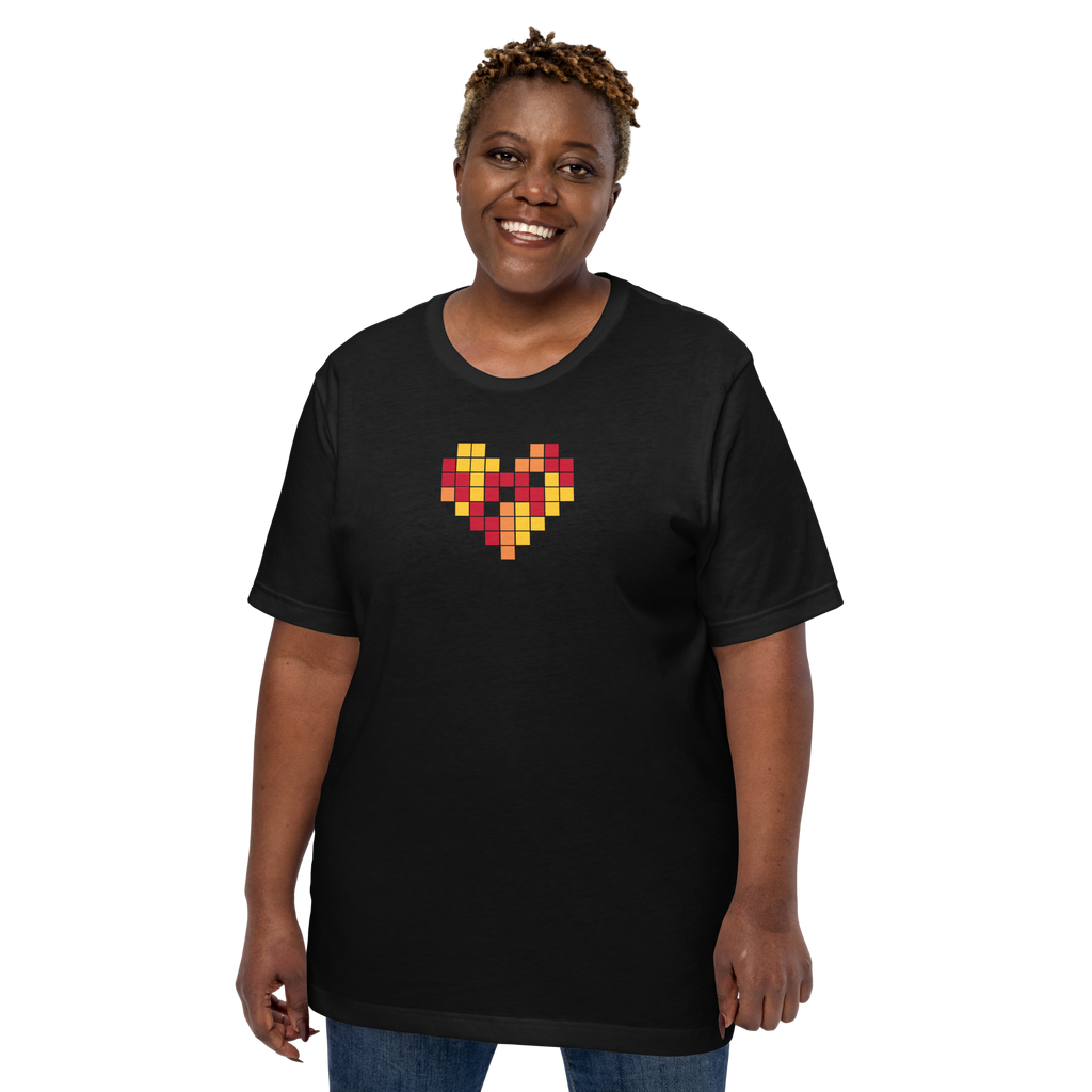 Person wearing a black t-shirt with a colorful heart design