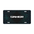 A rectangular novelty license plate with rounded corners, featuring a black center, a white stylized 'GAMER' text in the middle, and a dark blue and teal pixelated diamond pattern on the top and bottom sections.